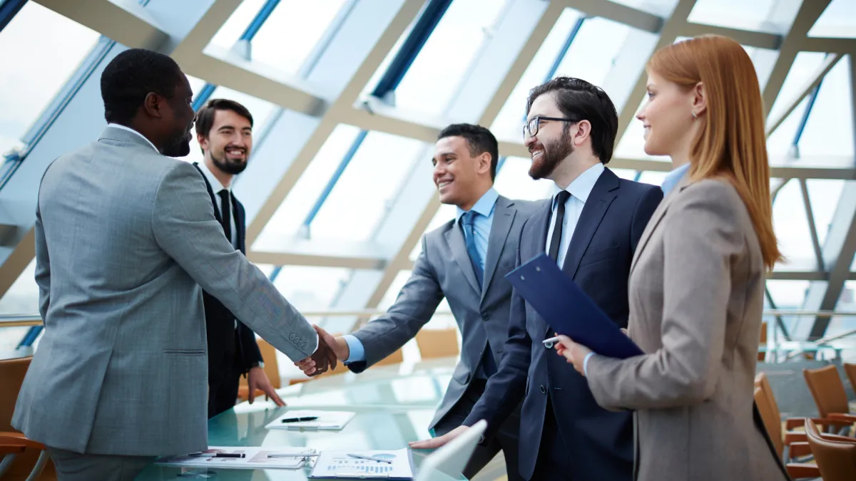 men and women having a meeting