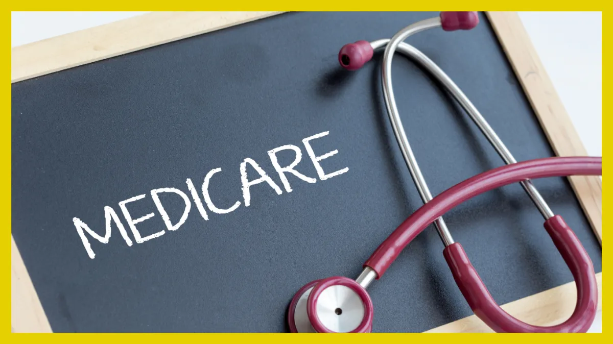 A stethoscope rests on a chalkboard displaying the word "MEDICARE,".