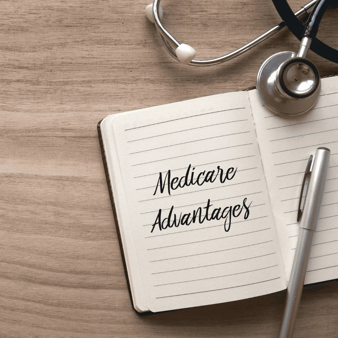 A notebook open to a page that reads "Medicare Advantages.