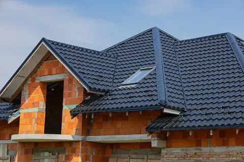 New residential roof installation by Central Arkansas Roofing on a brick home