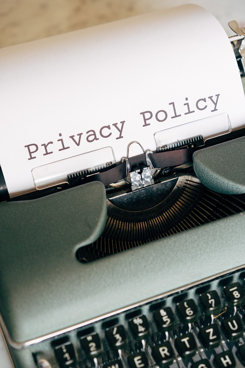 typewriter with privacy policy document being typed
