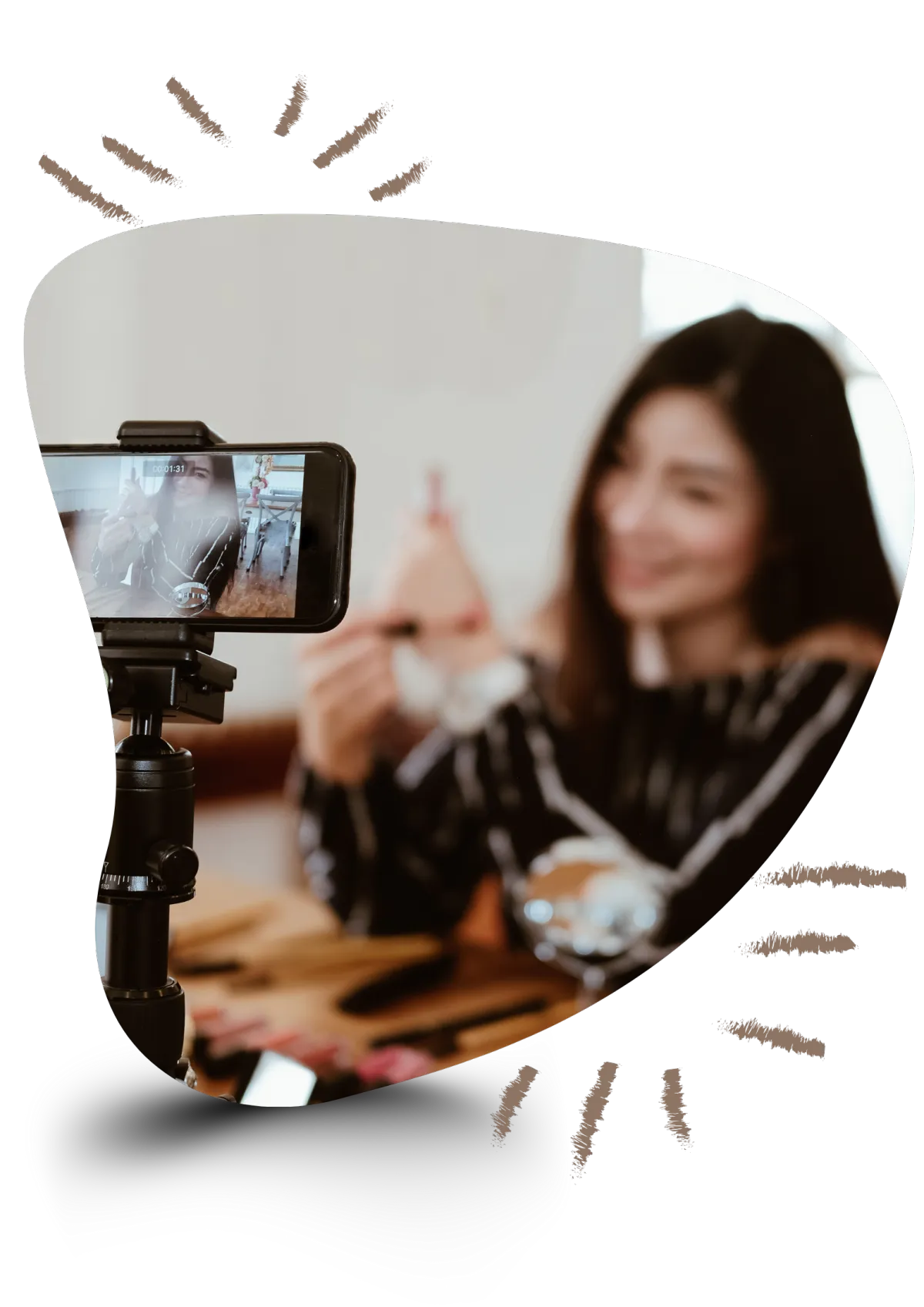 Image of someone filming on a mobile phone