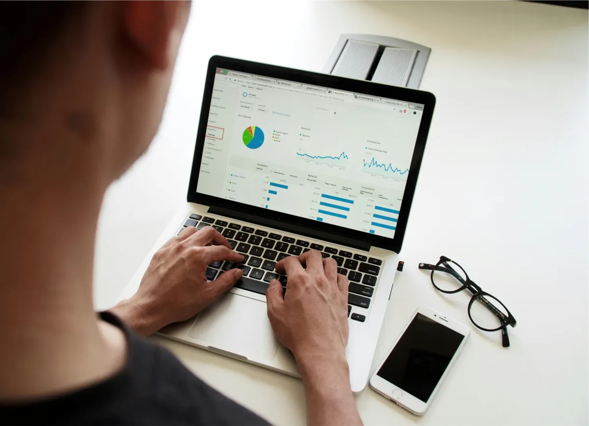 Image of someone on a laptop with data