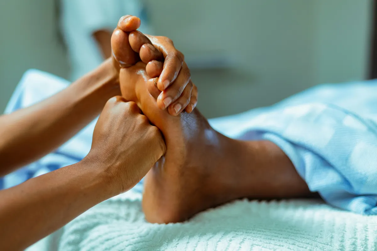 Hands providing a foot massage