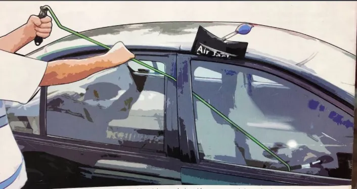 Locksmith opening a locked car door