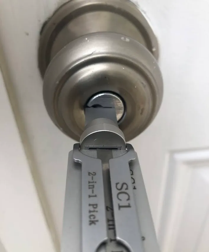 Technician unlocking a residential door safely