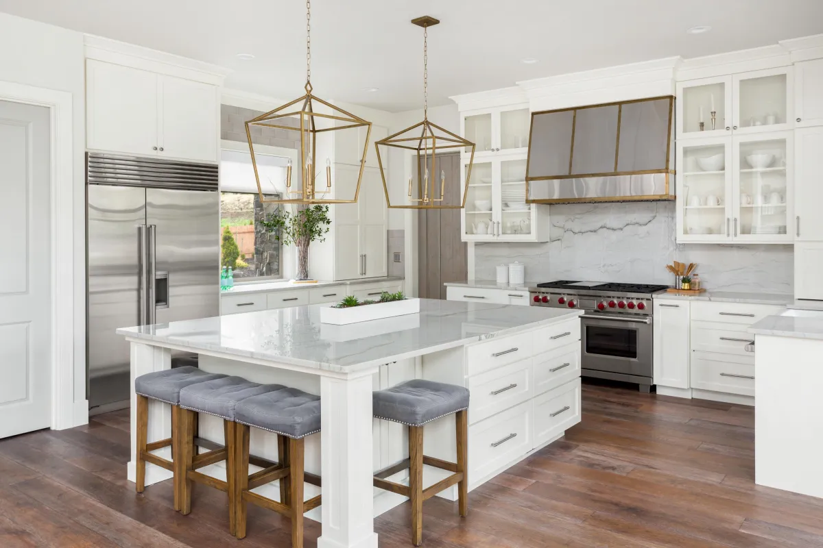 A large kitchen with a center island and a chandelier