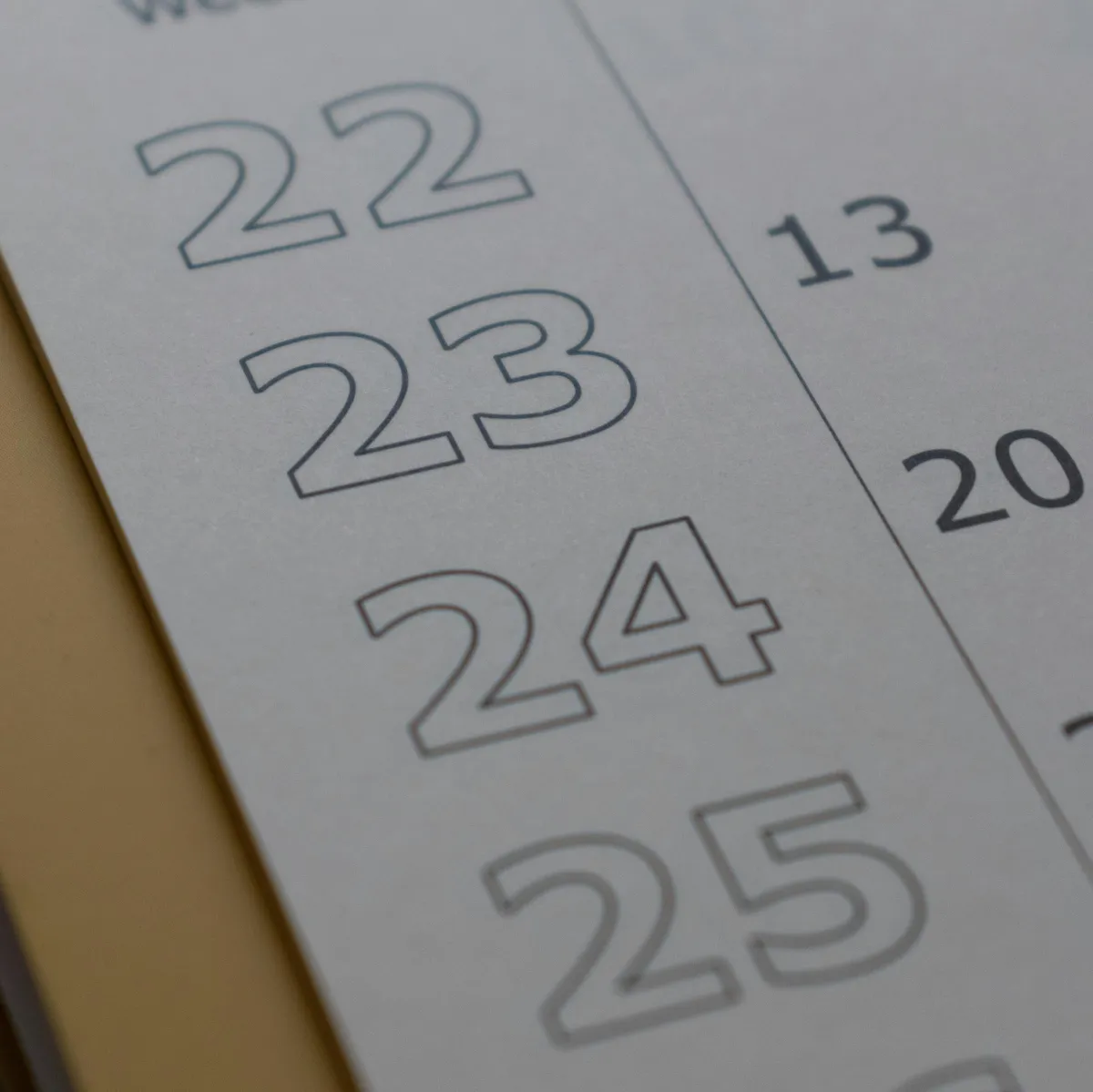 A creative team of professionals planning on a glass board, blue and gold accents, energetic mood, modern office, 3:2 aspect ratio. The scene conveys progress and innovation, with visible sketches and digital devices, highlighting teamwork and forward-thinking.