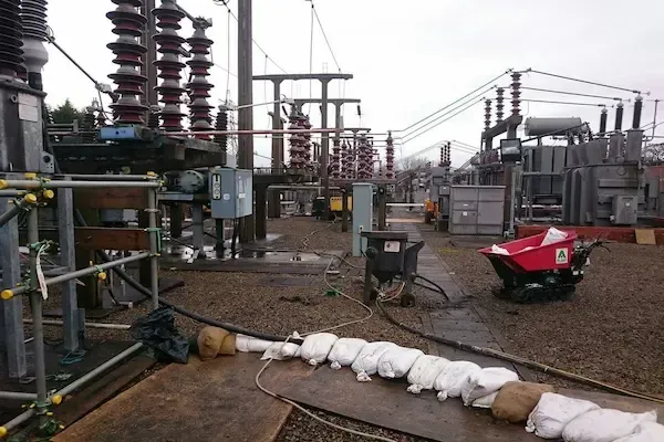 Power station substation infrastructure with overhead pylons