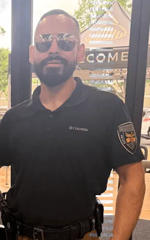Professional security officers walking through a commercial business district
