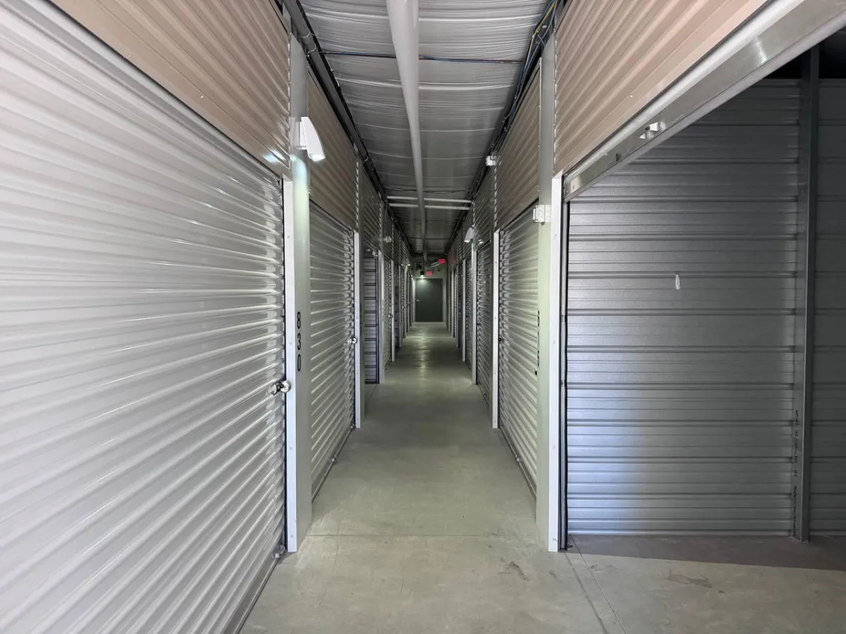 a yellow wall with a pay phone in it