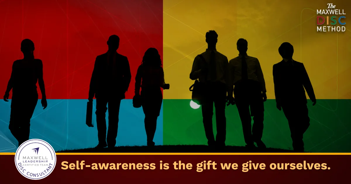 Winding road through autumn trees and rolling hills.