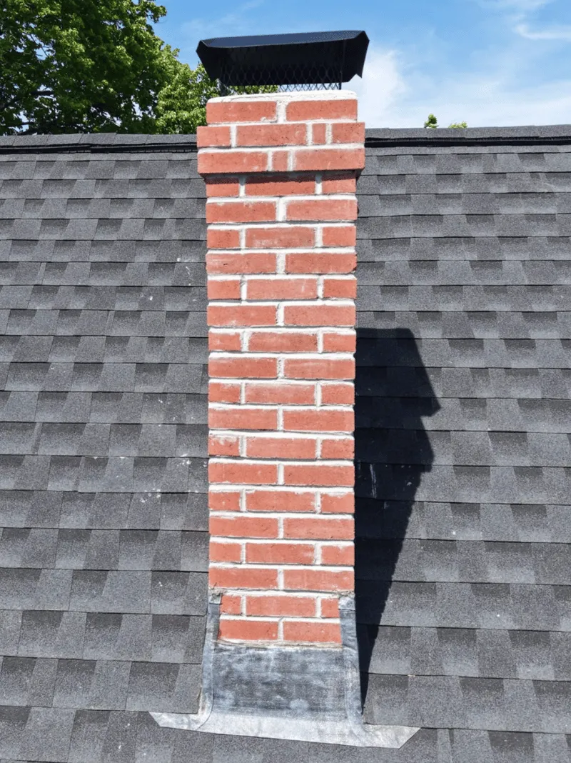 Roof replacement work in progress on historic brick home in Malden MA
