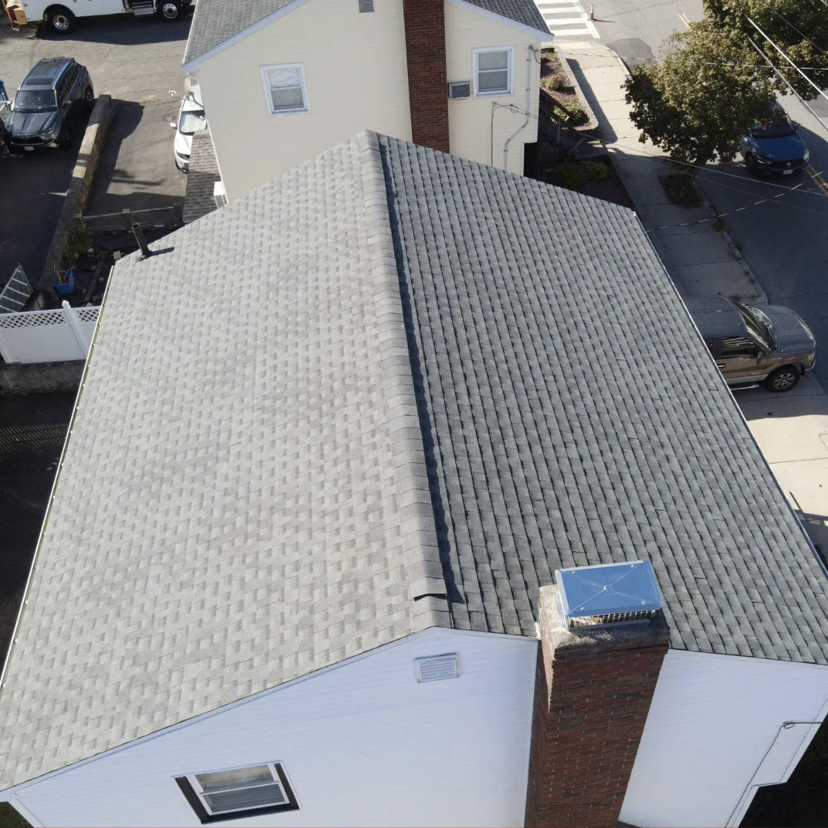 Roof replacement work in progress on historic brick home in Malden MA