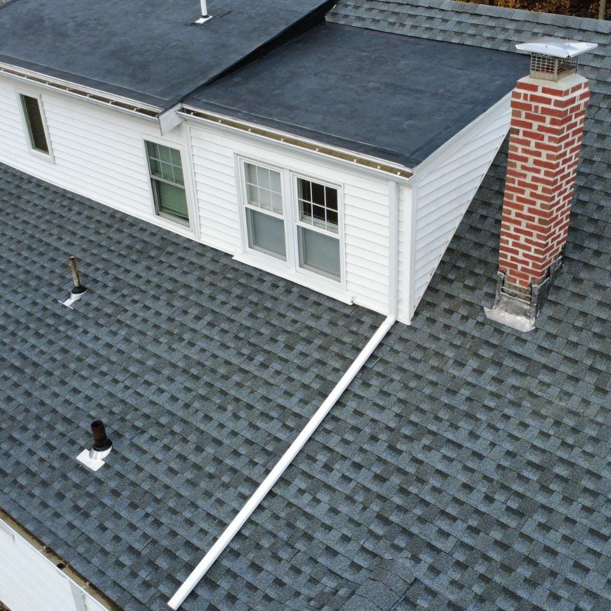 Roof replacement work in progress on historic brick home in Malden MA
