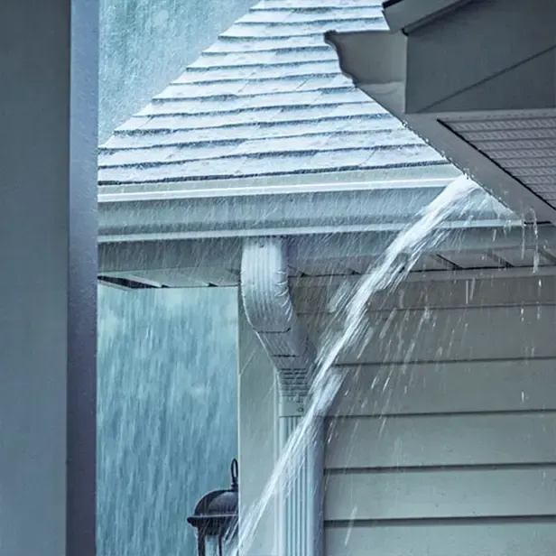 Overflowing gutters during heavy rain in Massachusetts home