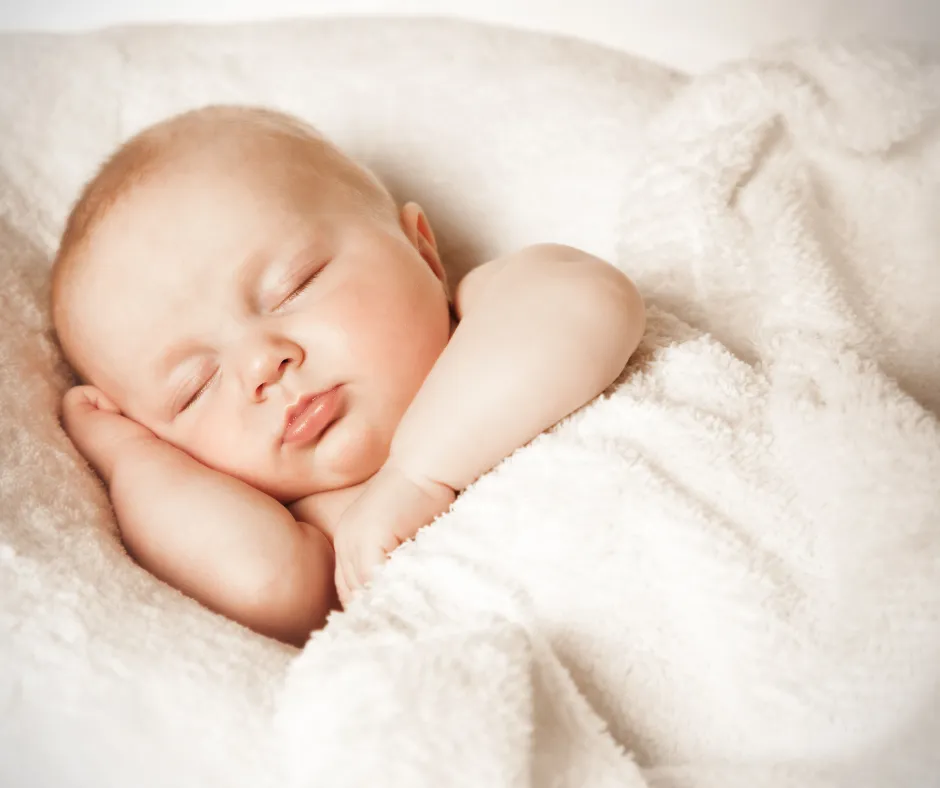 Sleeping newborn supported by a Melbourne sleep consultant specialising in baby sleep and regressions