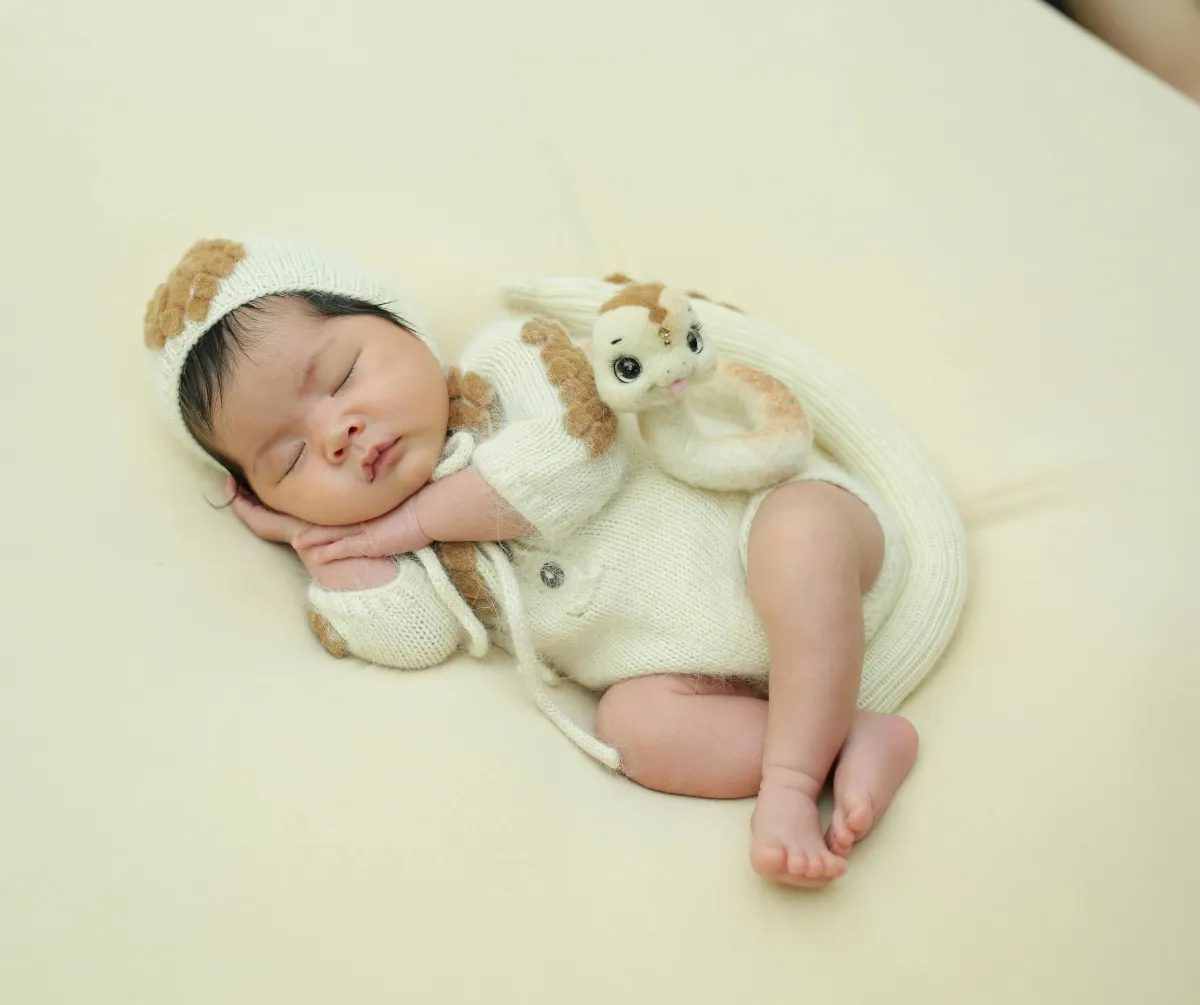 Sleeping four month old baby lying on their back