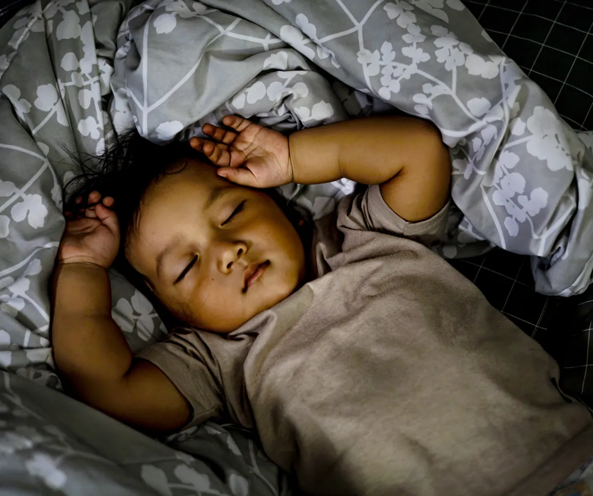 Child experiencing night terrors and parasomnias during sleep