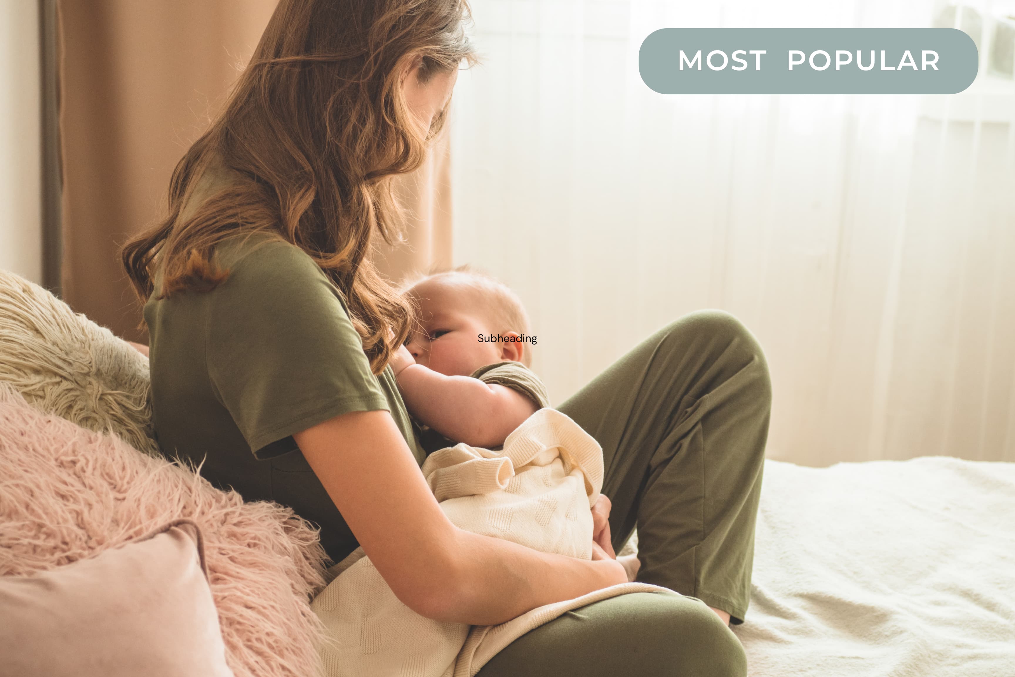 Mother cuddling her baby on a bed in a softly lit room.