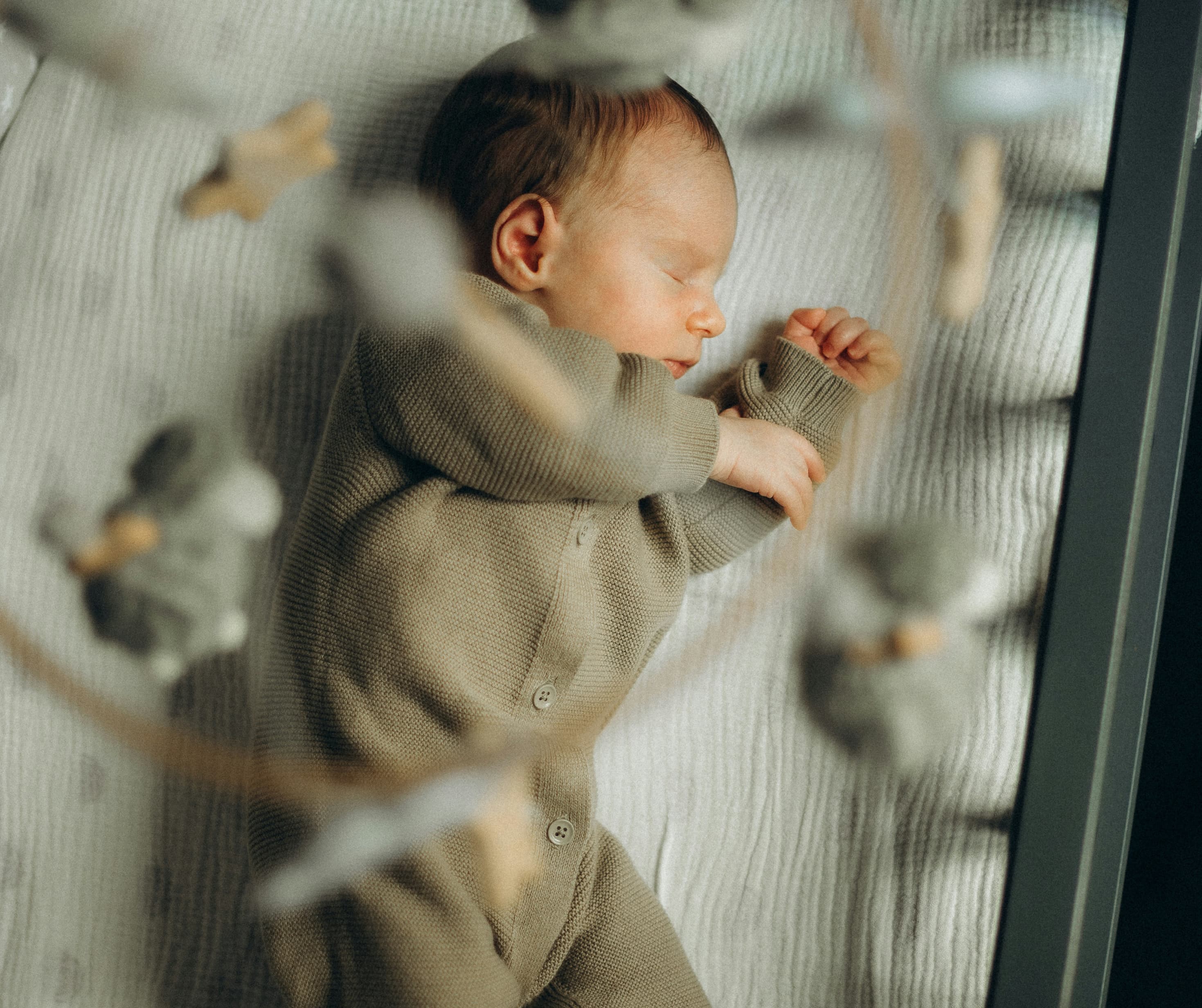 Baby sleeping during age appropriate baby sleep routine support