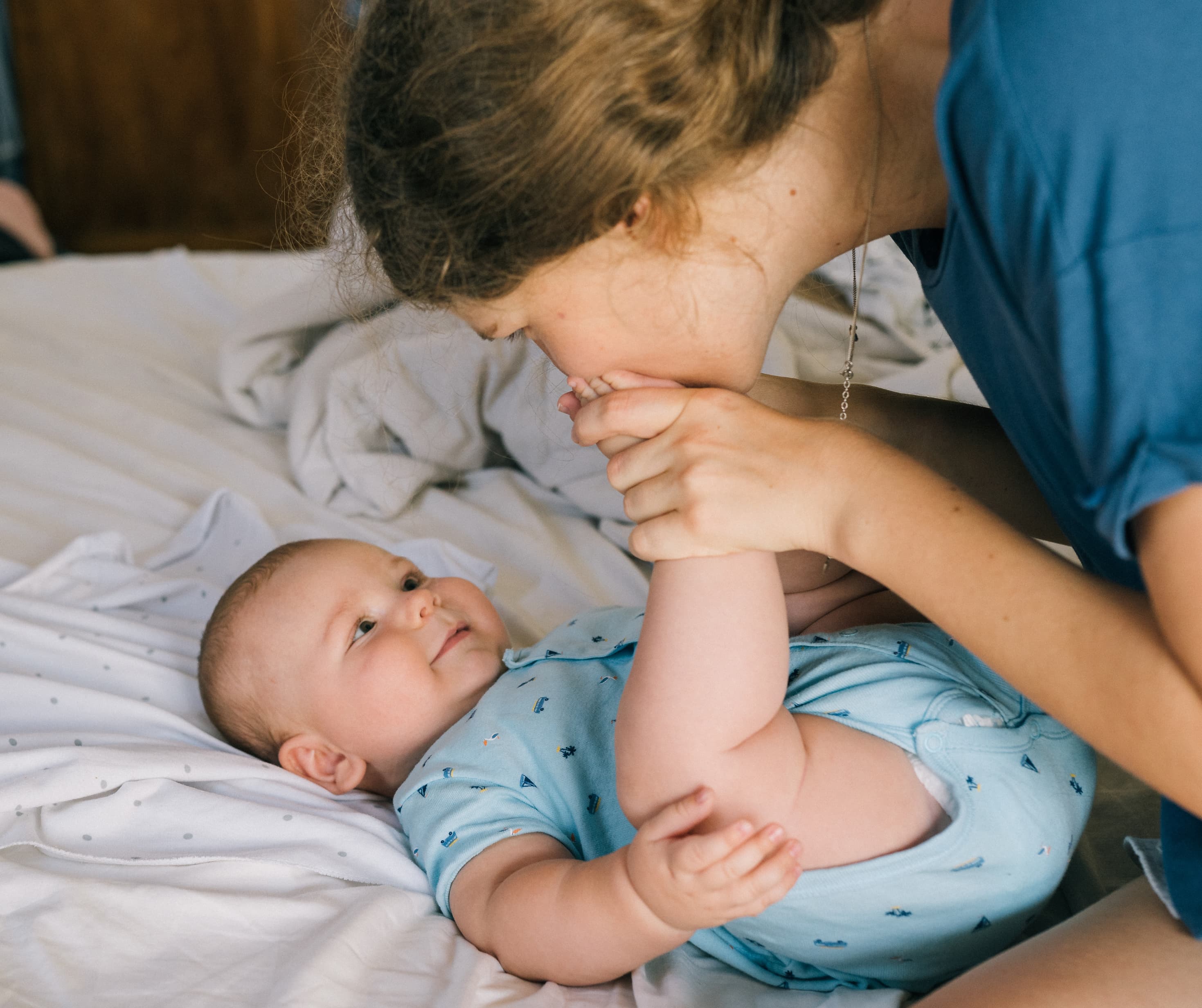 Parent playing with baby during baby sleep support