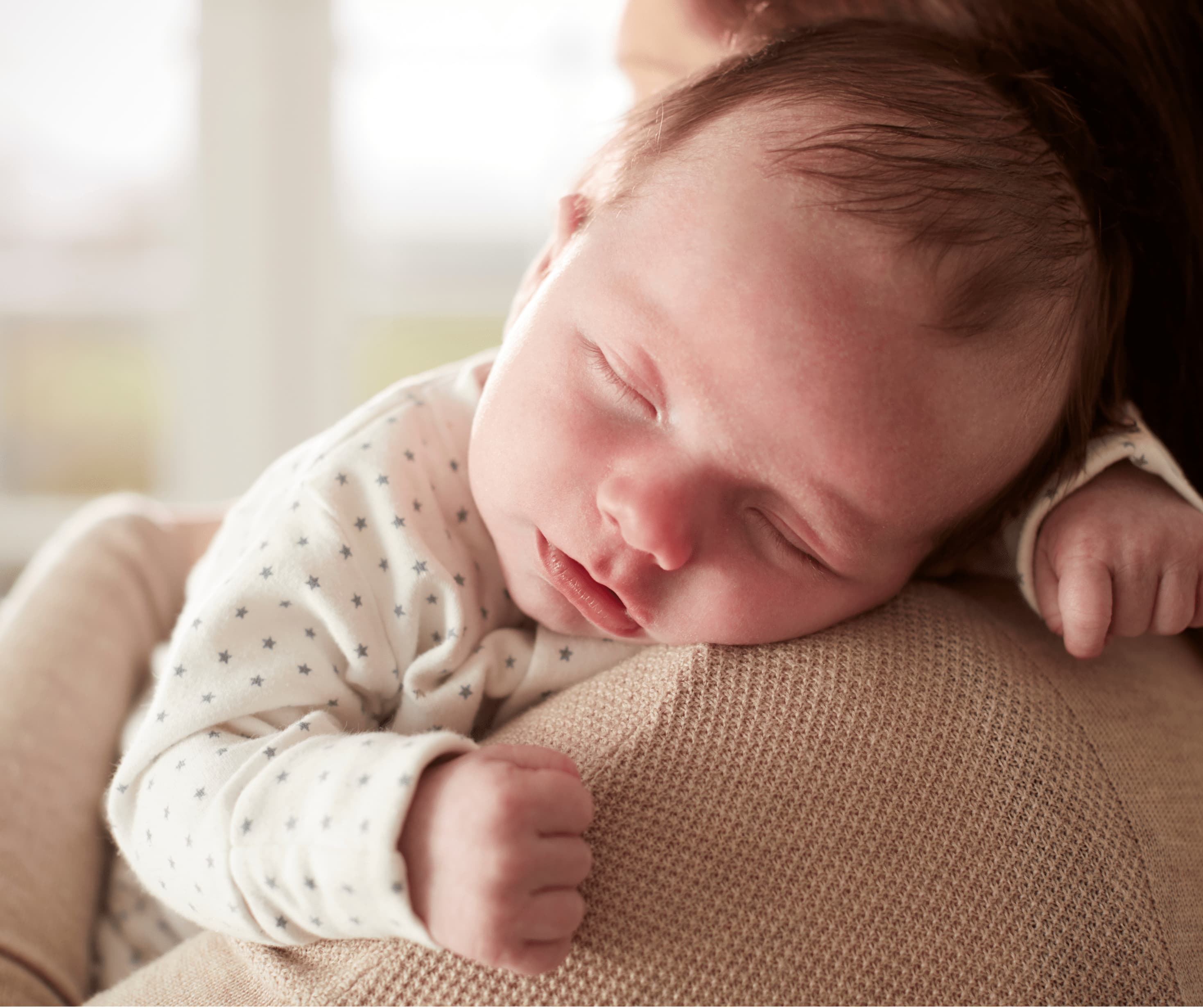 Newborn baby sleeping during reflux and sleep support