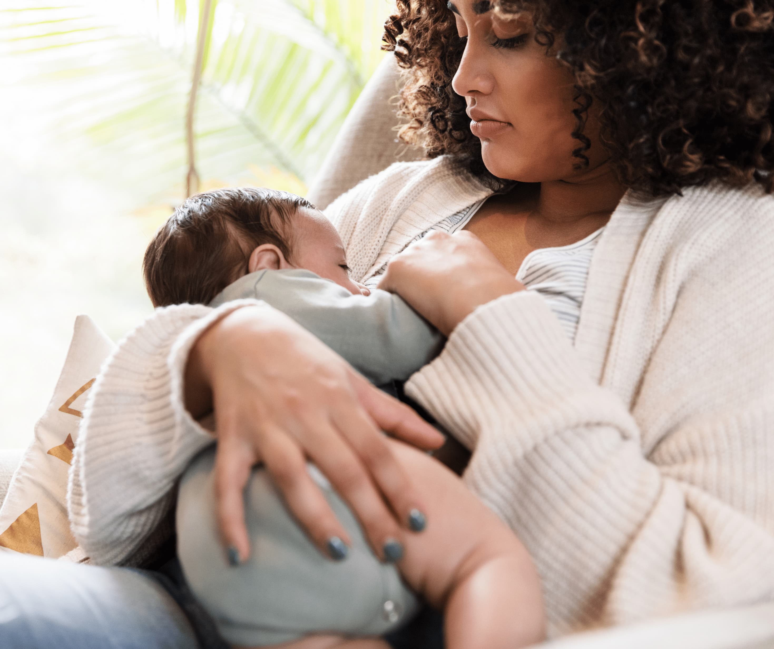Parent feeding baby during night feeding and sleep support