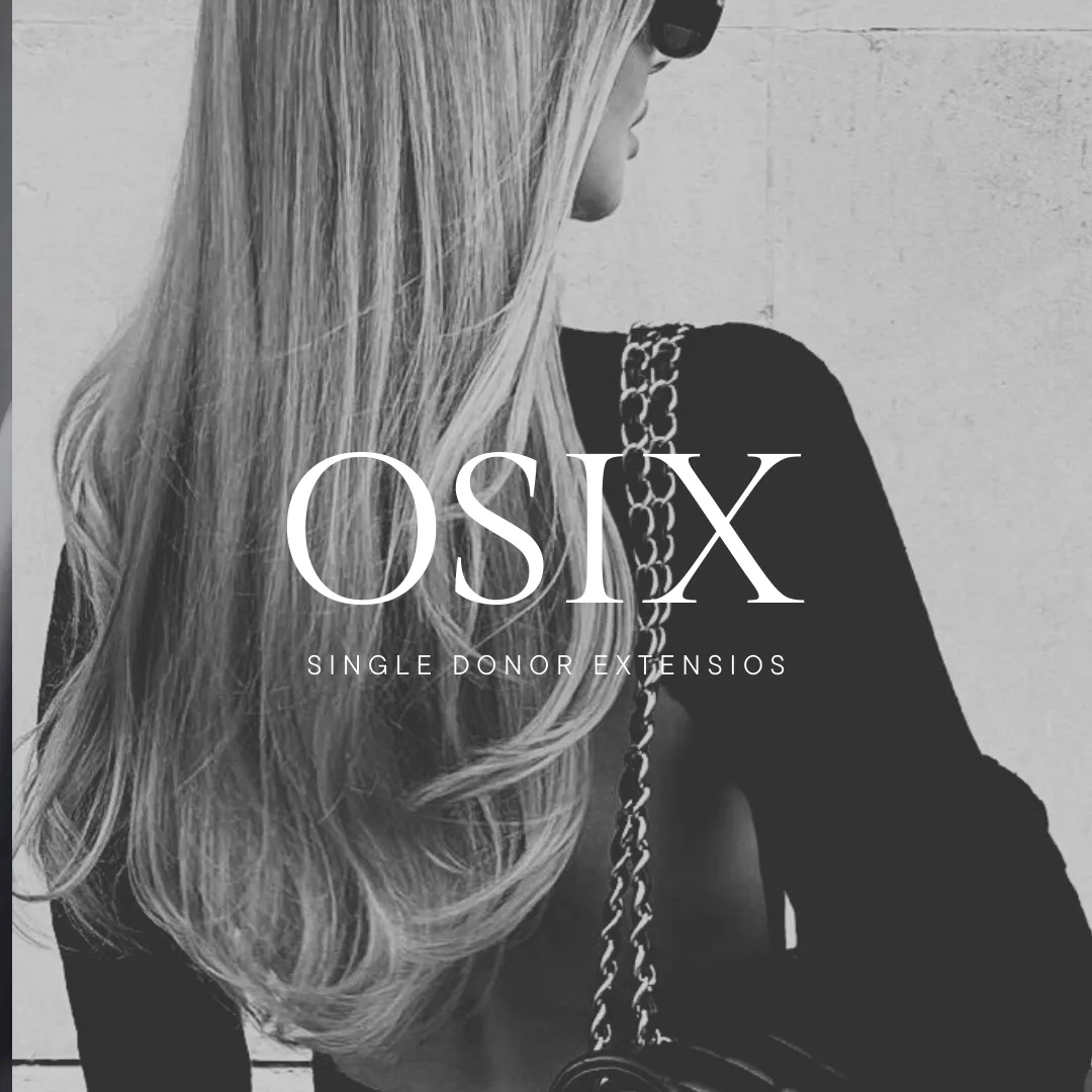 woman in white shirt standing near black leather chairs