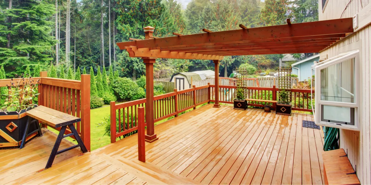 Custom backyard deck and patio installation built for outdoor living, dining, and relaxation