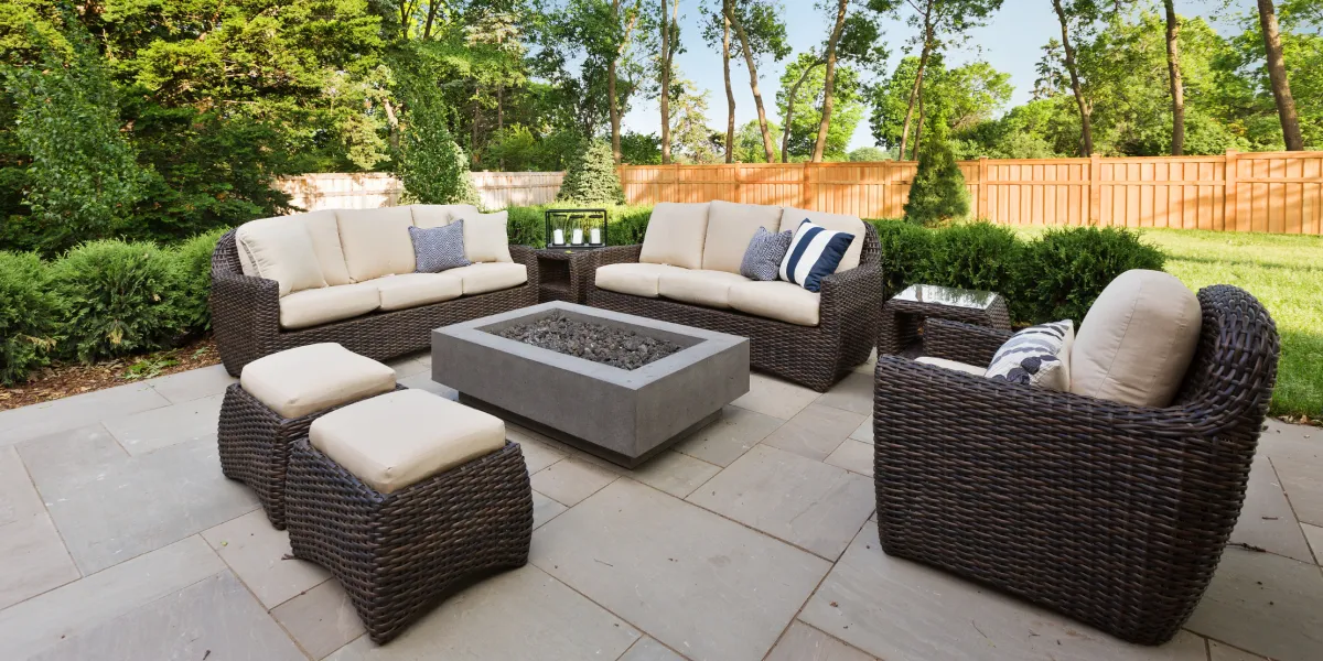 Professional hardscape design featuring paver patio, retaining walls, and outdoor steps