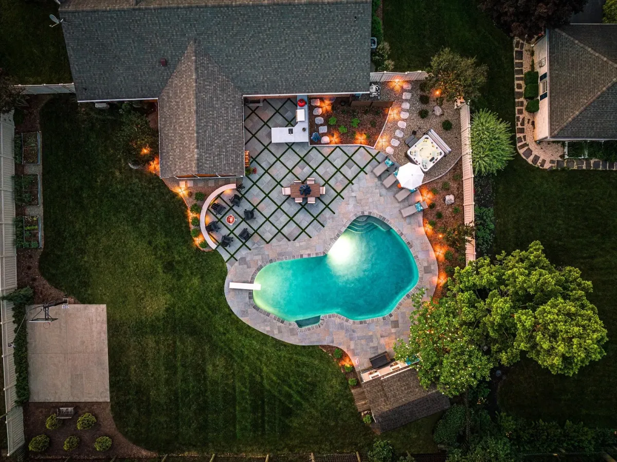 Aerial view of a custom pool and patio created by a landscaper in Ambler, PA.