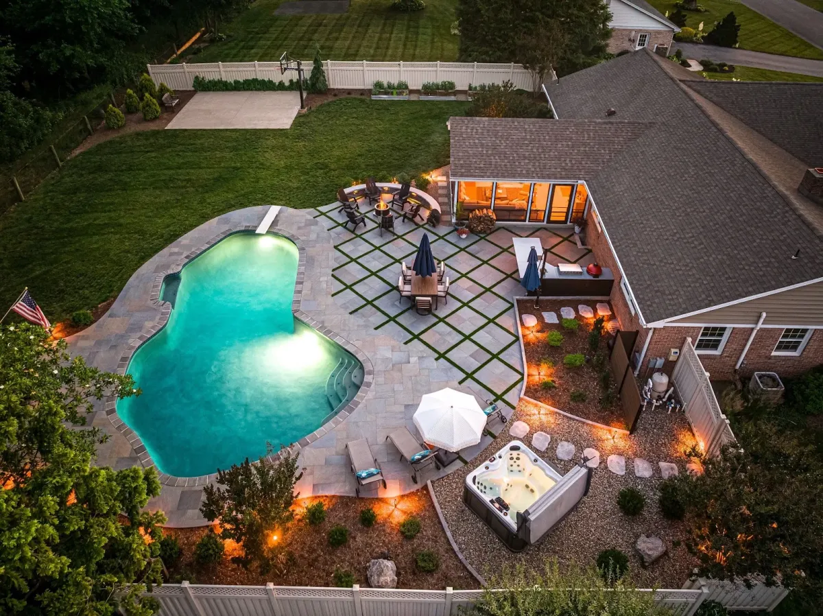 Aerial view of a custom pool and patio designed by a landscaper in Ambler, PA.