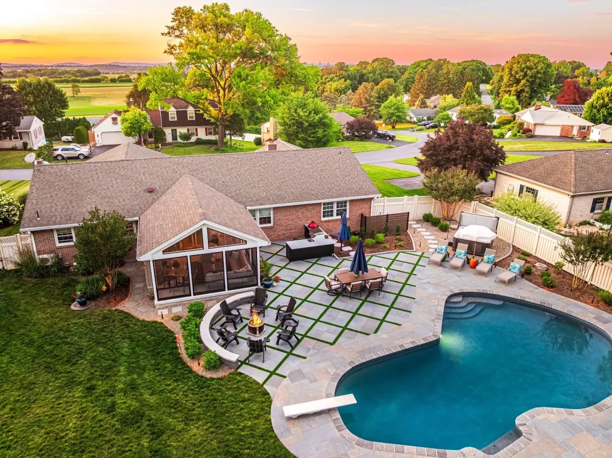 Aerial view of a custom patio, pool, and fire pit created by a landscaper in Bridgeport, PA.