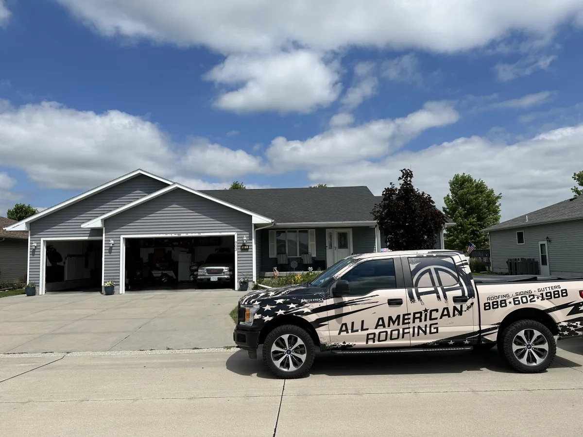 a truck at the front of a house