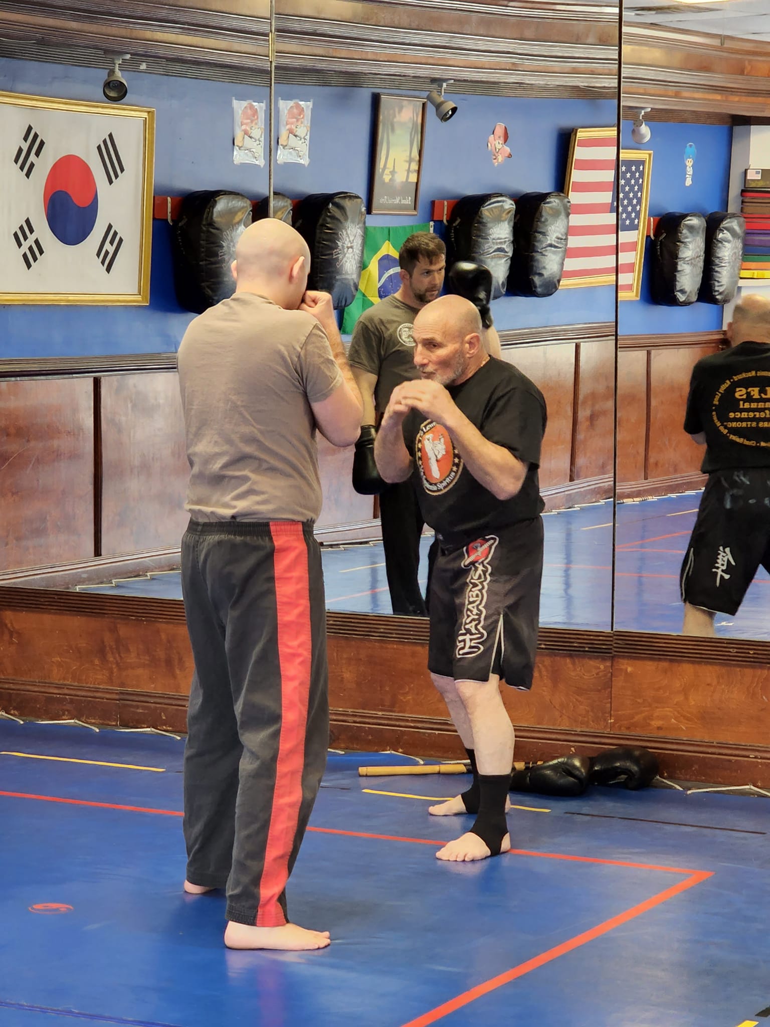 Woman practicing karate in front of city lights