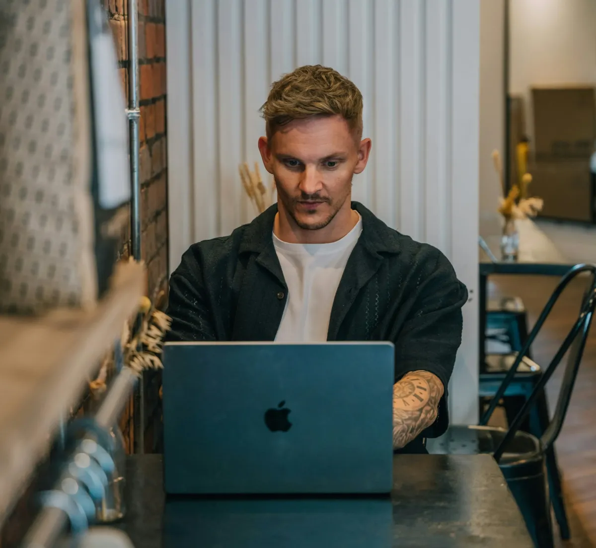 Marketing professional working on laptop developing SEO strategy
