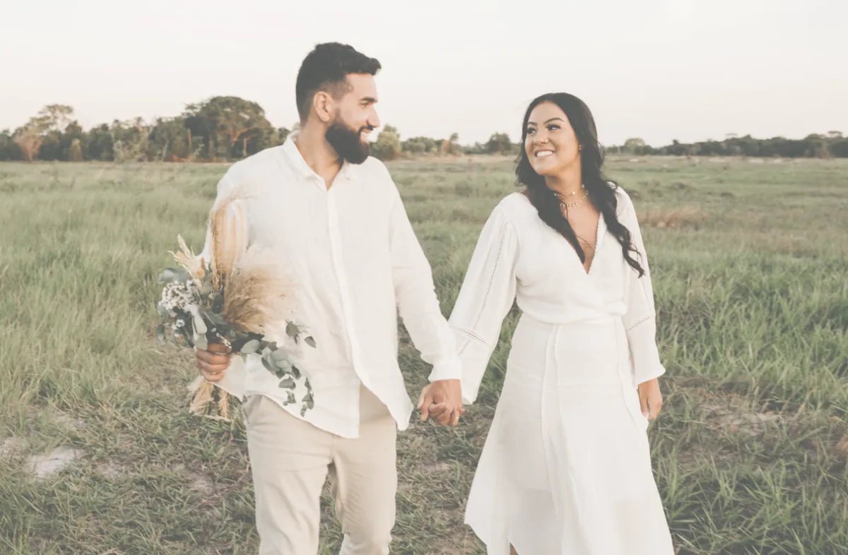 Green rolling hills under a bright blue sky.