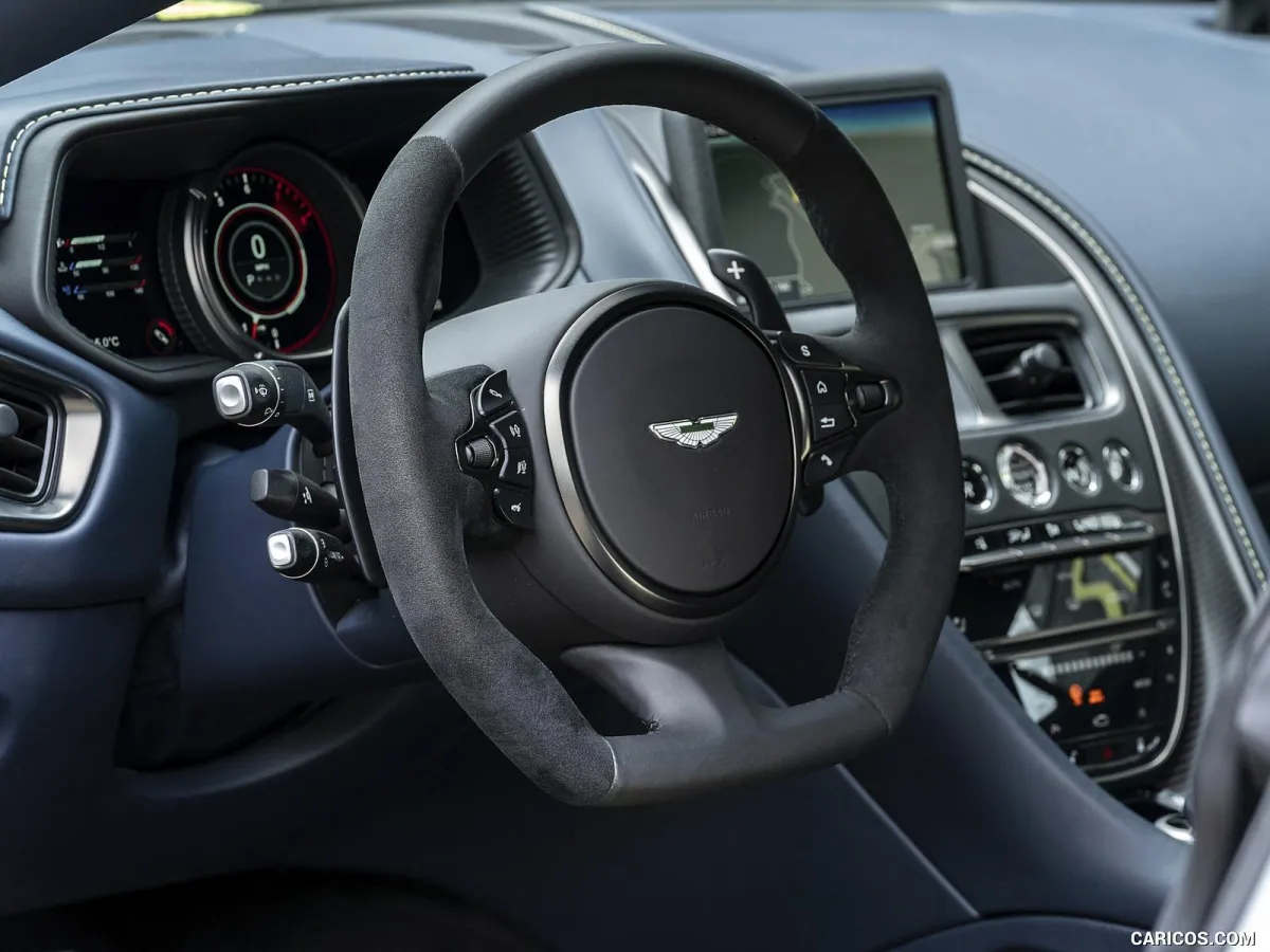 Clean and shiny Porsche leather steering wheel and red interior