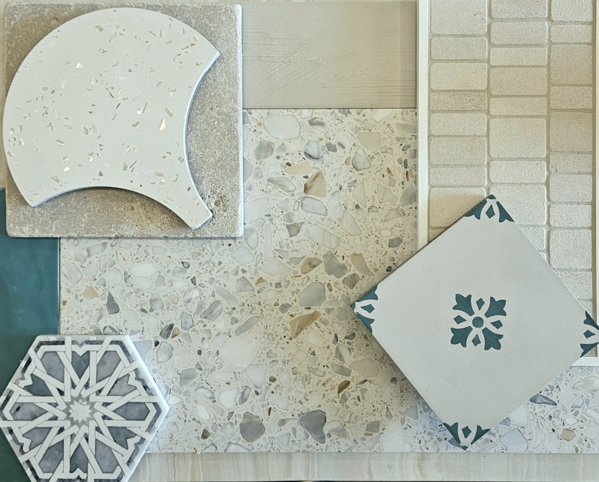 Mix of materials including terrazzo, cement tile, and natural stone items.