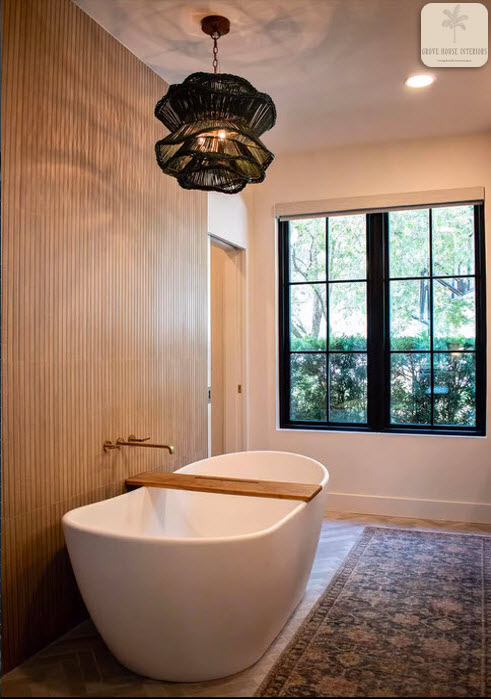 Bath renovation with fluted wood-look wall tile and beige, brick-look porcelain in a herringbone pattern