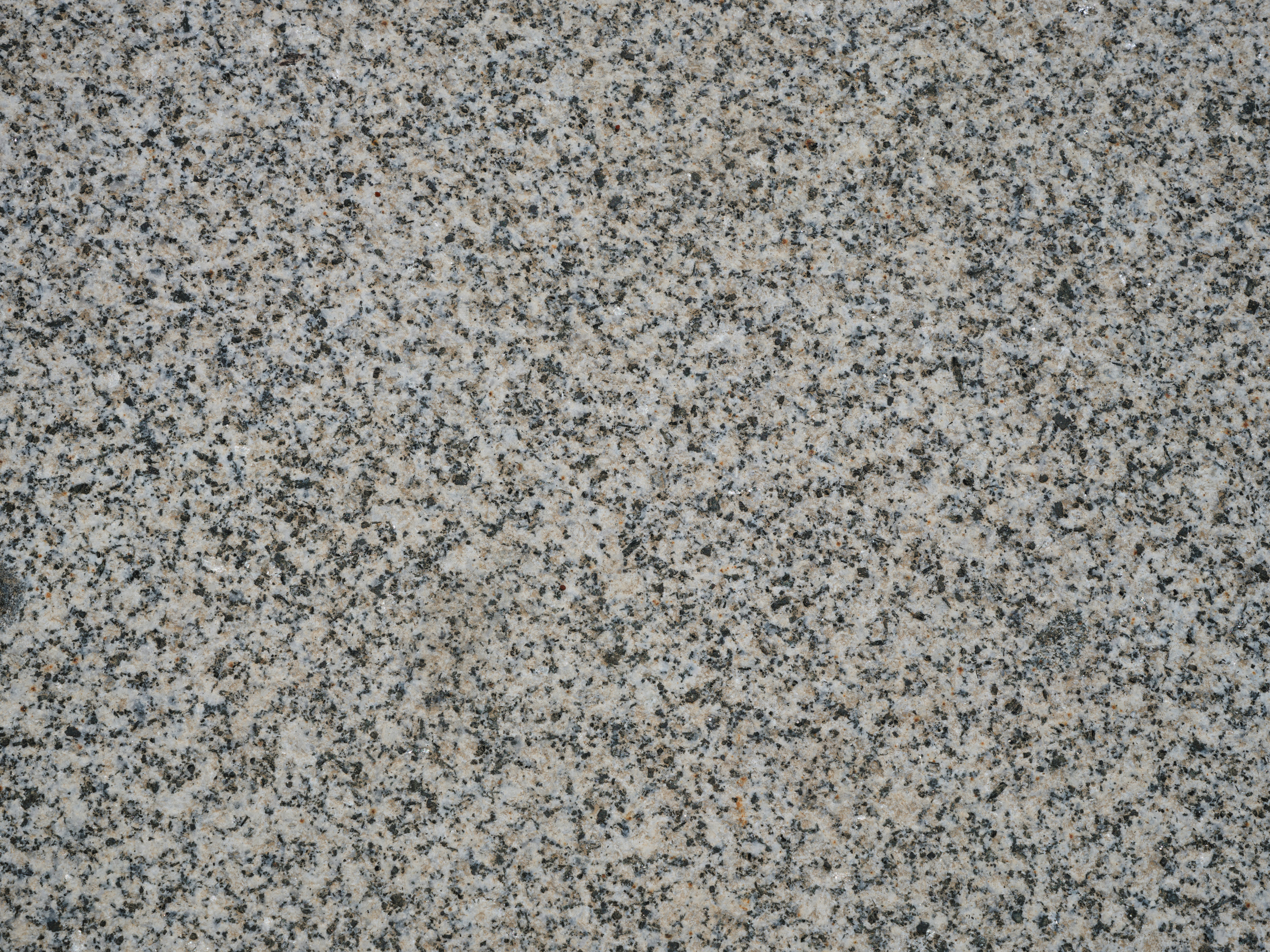 texture of a gray, black, and white decorative flake epoxy floor coating