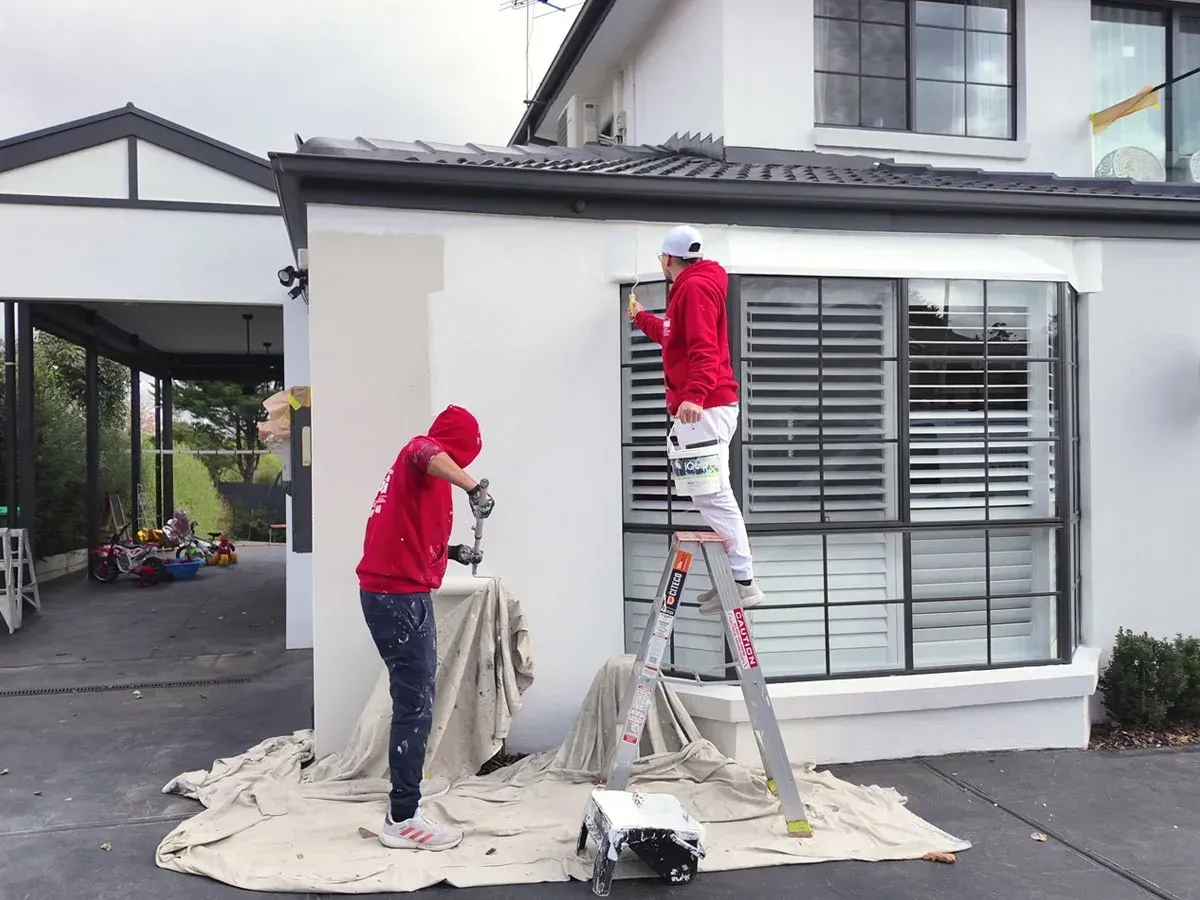 a woman sitting at a desk with a laptop computer