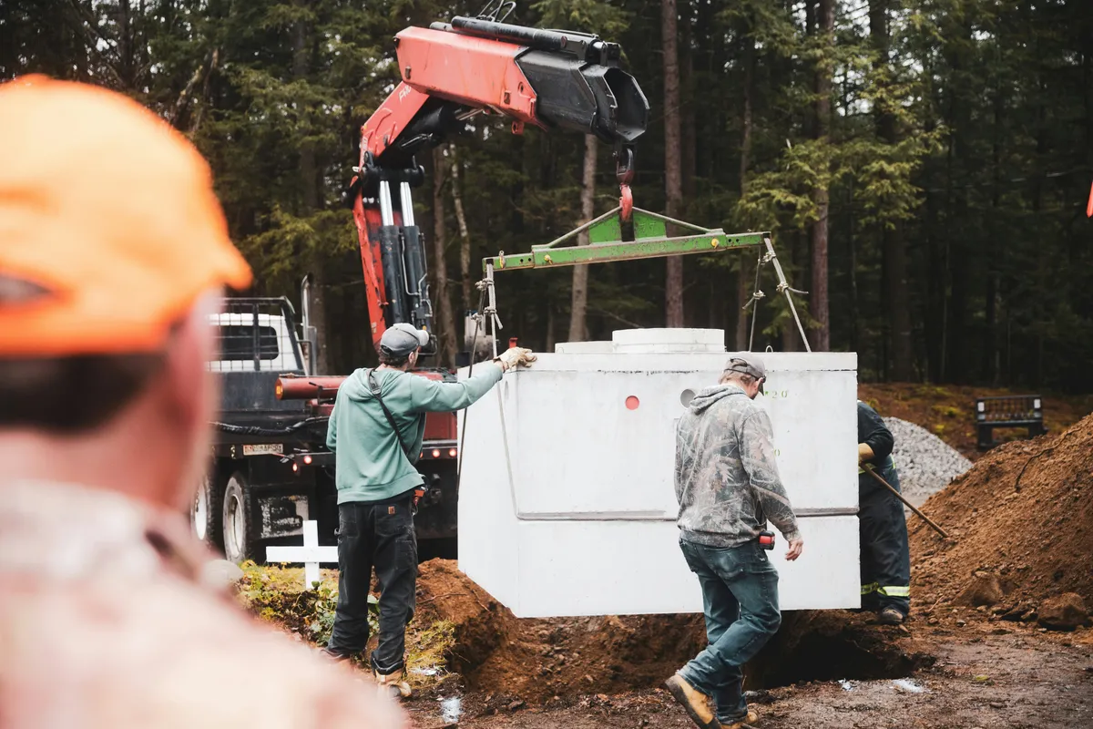 Septic tank installation with excavation equipment