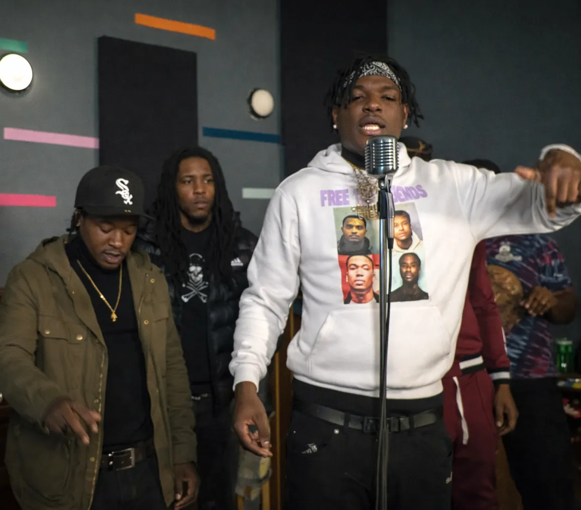 Stage lighting and plants framing a performance space