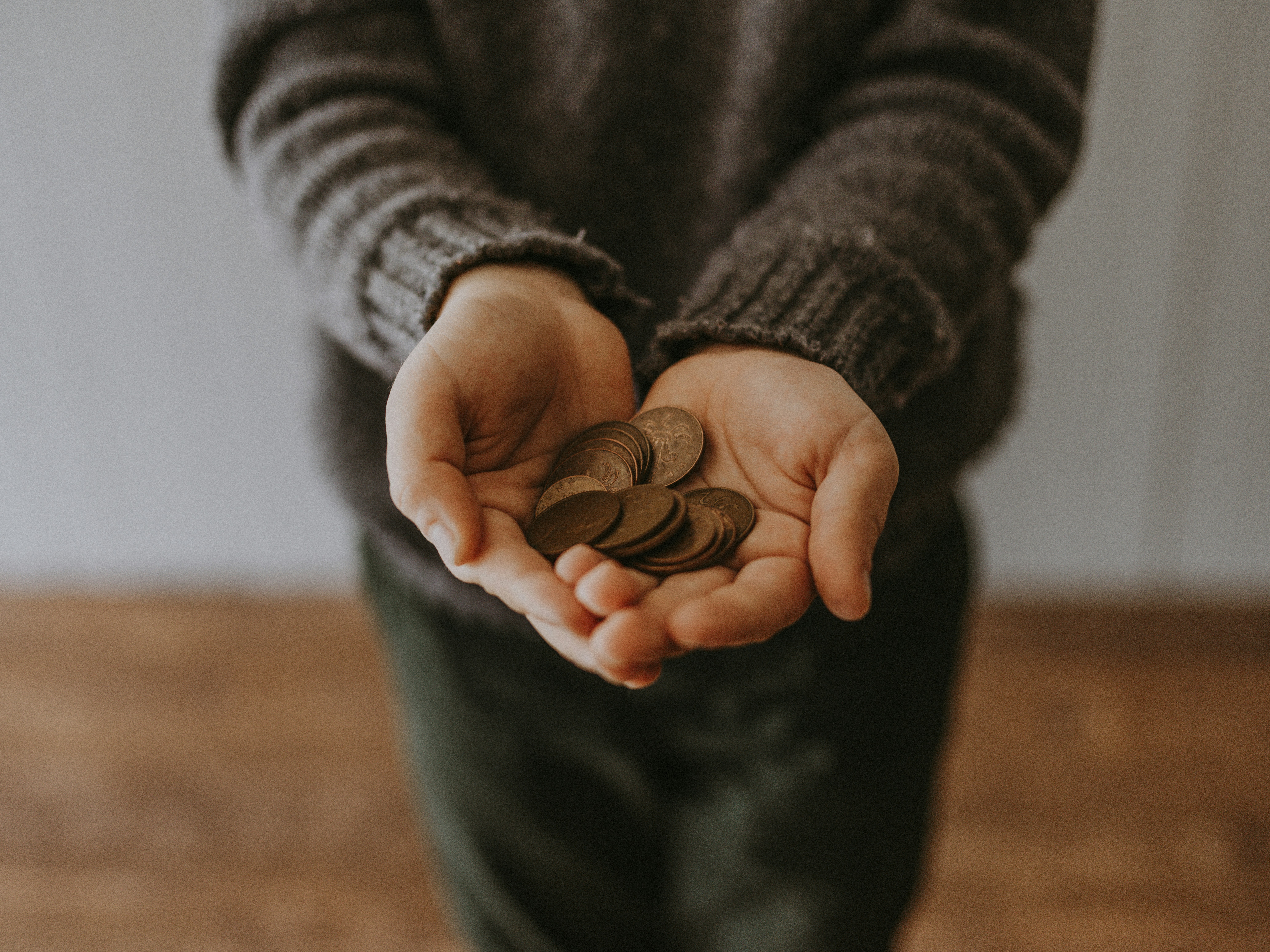 Kid holding coins