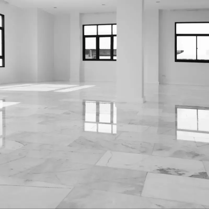Highly polished marble-effect stone floor restored by Cornwall Floorcare