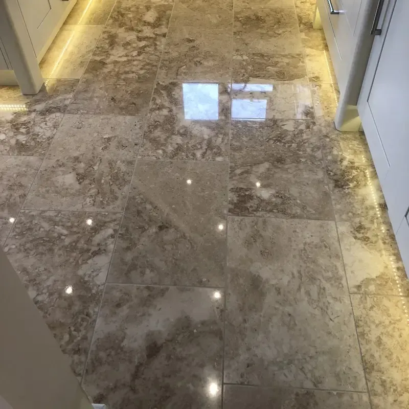 Highly polished natural stone floor restored by Cornwall Floorcare
