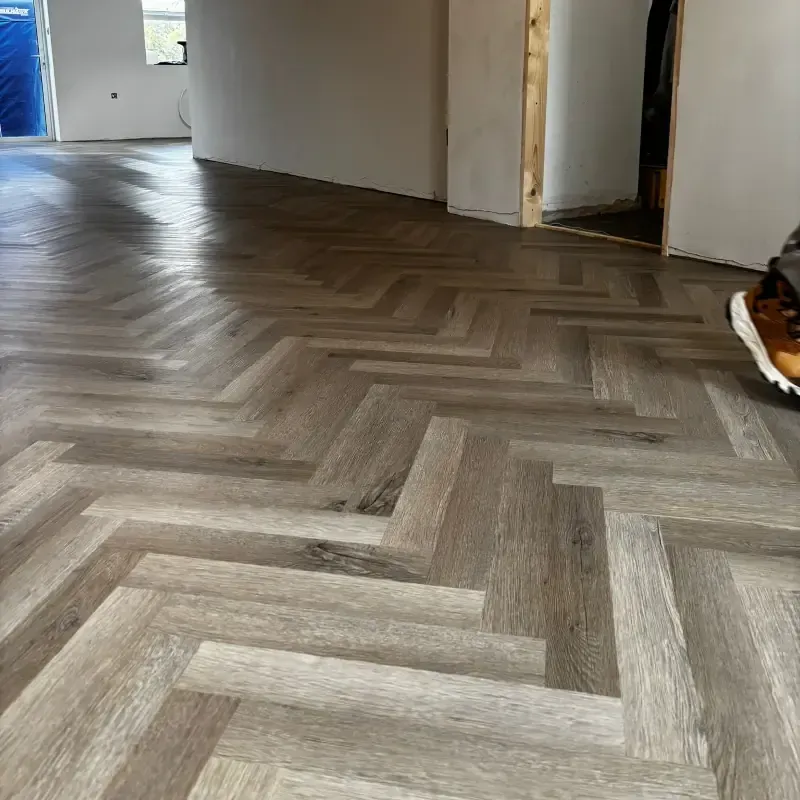 Herringbone luxury vinyl tile flooring installed by Cornwall Floorcare