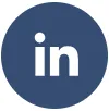 LinkedIn logo in white on a circular blue background.